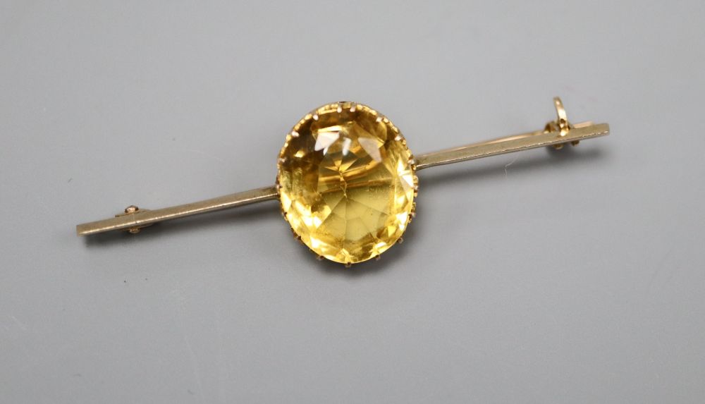 A 15ct gold gem set bar brooch, 5.25cm